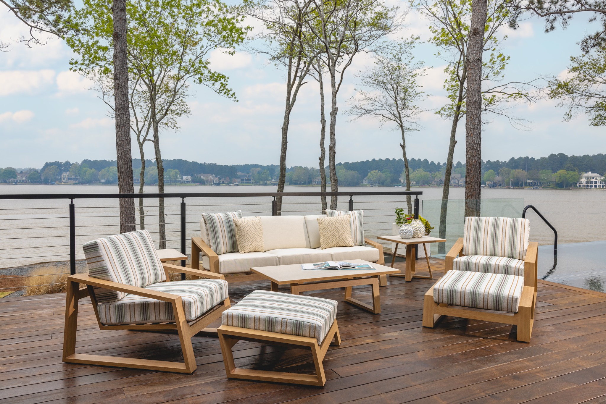 Outdoor coastal furniture on beachside patio.